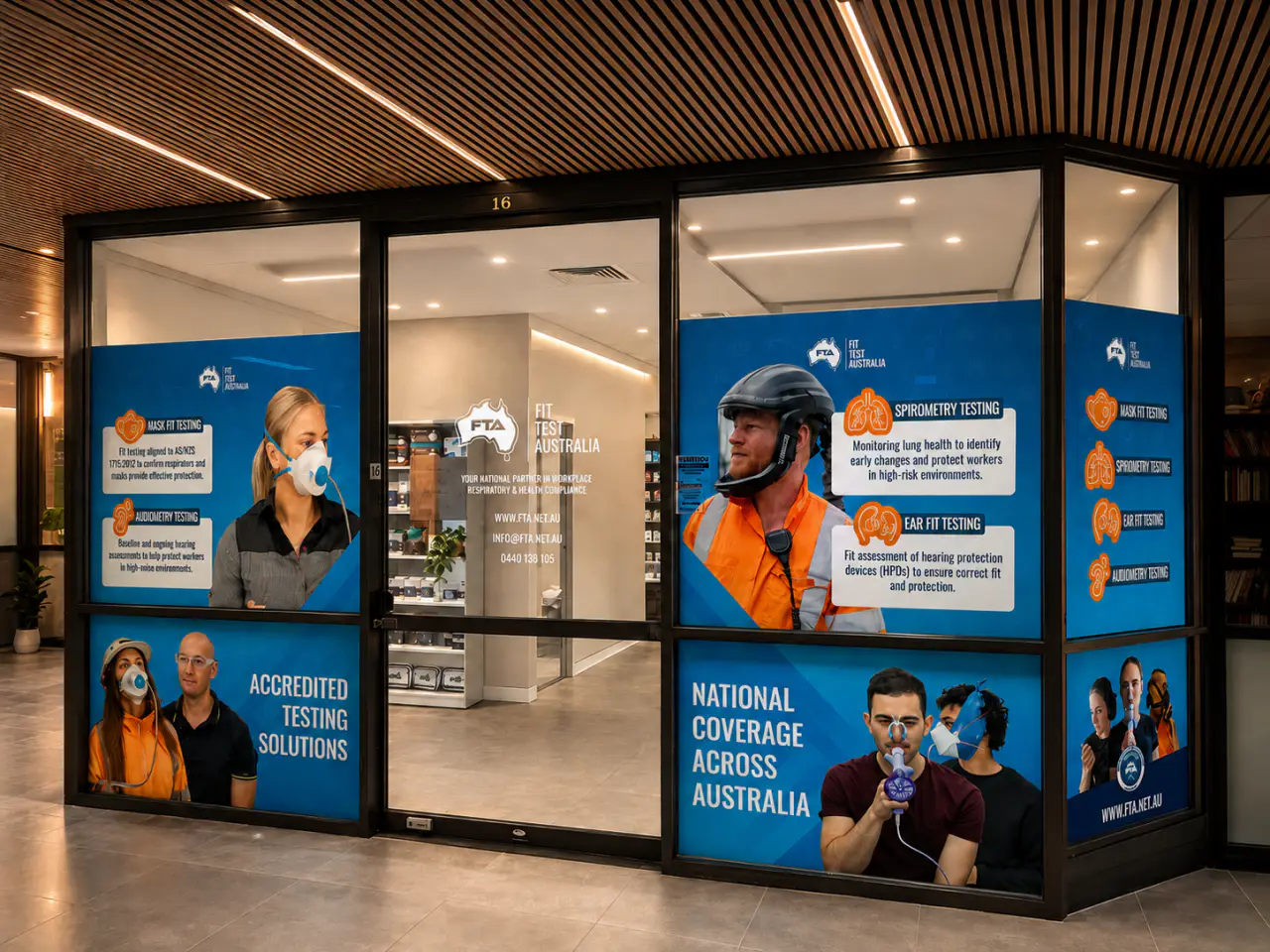 The Fit Test Australia clinic in Brisbane — a branded shopfront of blue panels advertising mask fit, spirometry, ear fit and audiometry testing